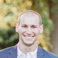 A person smiling for the pictureDescription automatically generated with medium confidence